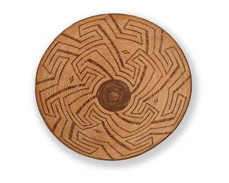 41
A Large Pima Basket
Early 20th century, Akimel O'odham; Southwest United States
A coiled basketry tray with a central swirling ancestral pueblo hooked motif
7" H x 21" Dia.
Estimate: $1,500 - $2,000