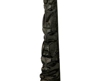 80
A Haida Argillite Totem Carving
Early 20th century; Pacific Northwest Coast
Unmarked
The carved stone totem representing five figures including a bear, raven, eagle and wolf, with a human face at base, and with a concave carved backside
17" H x 4.5" W x 3.25" D
Estimate: $2,000 - $3,000