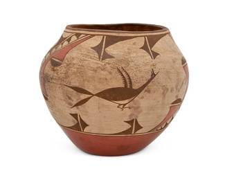 271
A Polychrome Zia Pueblo Olla Pottery Jar
Early 20th century; New Mexico
Marked to underside: Zia / [illegible]
The pottery jar with black and red roadrunner and kiva step motifs about a terracotta wash
6.75" H x 8.25" Dia.
Estimate: $200 - $400