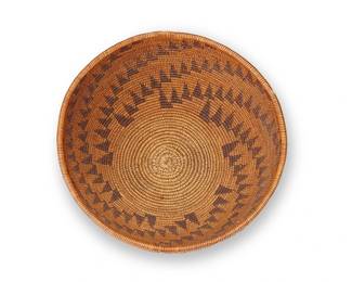 207
A Maidu Basketry Bowl
Early/mid-20th century; Northeastern California
A coiled bowl with nine radiating bands of joined triangles
4.25" H x 8.625" Dia.
Estimate: $400 - $600