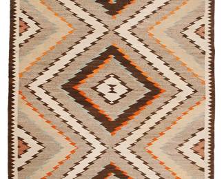 165
A Navajo Regional Rug
Mid-20th century, Diné
Woven in brown, grey, cream, orange, and green wool with a central column of conjoined serrated diamonds and sawtooth border to sides
52.5" H x 38" W
Estimate: $200 - $400