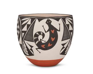 268
An Acoma Pueblo Polychrome Pottery Bowl
Late 20th/21st century; New Mexico
Signed to underside: S. Garcia / Acoma N.M.
The likely Sarah Garcia (1928-2015, Acoma Pueblo) three-color deep bowl with black and red lizard and geometric motifs on white ground
7.25" H x 7.75" Dia.
Estimate: $200 - $300