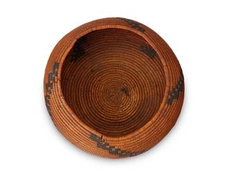 46
A Pomo Basket
Early 20th century; Central California
A coiled globular low bowl with four stepped narrow columns
3" H x 6.75" Dia.
Estimate: $300 - $500
