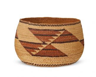 202
A Small Polychrome Hupa/Yurok/Karuk Basket
Early/mid-20th century; Northern California
A twined basketry bowl with three floating geometric motifs with imbricated accents
4.125" H x 6.5" Dia.
Estimate: $400 - $600