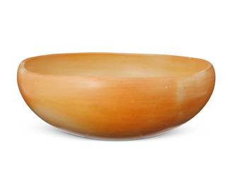 274
A Hopi Pueblo Piki Bread Bowl
Late 20th century; Arizona
Appears unmarked
The yellowware pottery bowl used for processing blue cornmeal to make piki bread
4.75" H x 13" Dia.
Estimate: $300 - $500