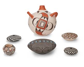 324
A Group Of Hopi Pueblo Polychrome Pottery Items
Mid/late 20th century; Arizona
Bird bowl signed: Annette Silas; small bowl signed: E. Adams / Hopi; spoon signed: C. Naha Nampeyo
The yellowware group comprising an Annette Silas (1915-1990, Hopi) bowl with three-color bird motif to interior, a Cheryl Naha Nampeyo (b. 20th century, Hopi) pottery spoon, and various bowls with geometric and avian motifs, 8 pieces
Tallest bowl: 4.125" H x 5.125" Dia.; spoon: 1" H x 4.5" L x 1.75" W
Estimate: $500 - $700