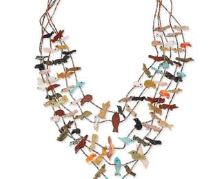 244
A Pueblo-Style Multistrand Fetish Necklace
Late 20th century
Cones stamped: Sterling
A five-strand necklace with various carved stone animal figures, all strung to sterling silver cones with likely porcupine quill beads, and with a central carved turquoise pendant
23.5" L x 2" H (pendant)
Estimate: $300 - $500