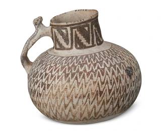 190
An Anasazi Tularosa Pottery Handled Jar
Pre-1500 AD
The jar with overall black on white zigzag geometric motif and stepped banding to neck, featuring a skunk figural handle
6.75" H x 7" Dia.
Estimate: $300 - $500