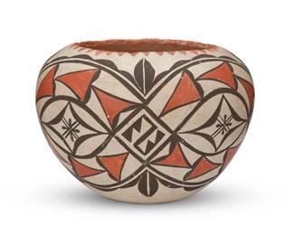 52
An Acoma Pueblo Polychrome Bowl
Mid-20th century; New Mexico
Appears unmarked
The three-color pottery bowl with brown and red on white buff featuring foliate and geometric motifs and an indented rim
5.625" H x 8" Dia.
Estimate: $200 - $400