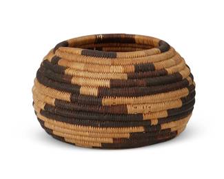 36
A Miniature Pomo Basket
Early 20th century; Northern California
A coiled diminutive globular bowl with all-over stepped motif
1.75" H x 2.75" Dia.
Estimate: $300 - $500