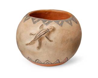 233
A Cochiti Pueblo Lizard Pottery Bowl
Early/mid-20th century; New Mexico
Appears unmarked
The bowl three-color bowl with sawtooth motif and opposed raised lizards
3.25" H x 4.875" W x 4.325" D
Estimate: $200 - $400