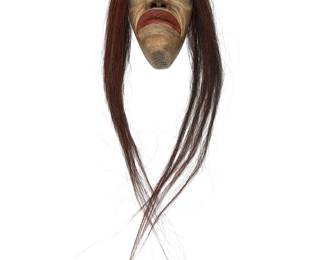 153
An Iroquois False Face Mask
Mid/late 20th century, Hodensosaunee; Northeastern North America
A carved dark-stained wood mask with metal overlay eyes, painted features, and horsehair hair
10.5" H x 6.125" W x 5" D; hair: 30" L approximately
Estimate: $300 - $500