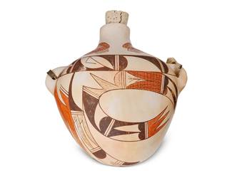 308
Pauline Setalla (B. 1930, Hopi)
A Hopi Pueblo polychrome pottery canteen, mid/late 20th century
Signed to underside: [bear paw] Pauline Setalla
The three-color canteen with corn cob and geometric motifs, cork stopper, and leather strap
11" H x 9.5" W x 6.5" D
Estimate: $200 - $300