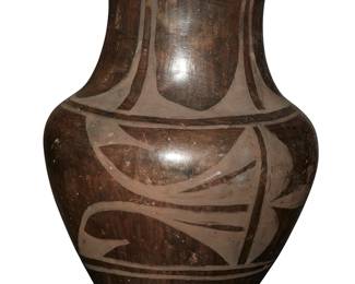 236
A Santo Domingo Pueblo Blackware Pottery Jar
Mid-20th century; New Mexico
Appears unsigned
A tall vase form jar with geometric slip motifs
9.75" H x 7.25" Dia.
Estimate: $200 - $400
