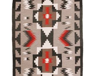 166
A Navajo Regional Rug
Mid/late 20th century, Diné
Woven in grey, red, black, and cream wool with two central stacked diamonds, floating motifs and a stepped border to long sides
39" H x 27" W
Estimate: $300 - $500
