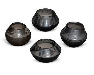 300
Four Puebloan Blackware Pottery Bowls
Four works:

Desideria Montoya (1889-1982, San Ildefonso Pueblo)
A blackware bowl, mid-20th century
Signed to underside: Desideria
The small bowl with painted slip geometric motifs
3.325" H x 4.325" Dia.

A blackware bowl, mid/late 20th century
Signed illegibly
The small bowl with black painted banded geometric motif on burnished black ground
3.25" H x 4.125" Dia.

A blackware bowl, mid/late 20th century
Incised to underside: Santana
The bowl with black painted banded sawtooth motif on burnished black ground
3.5" H x 5" Dia.

A blackware low bowl, mid/late 20th century
Possible illegible signature to underside
The low-shouldered bowl with black painted kiva step and geometric motifs on a burnished black ground
2.875" H x 4.625" Dia.

4 pieces
Estimate: $300 - $500