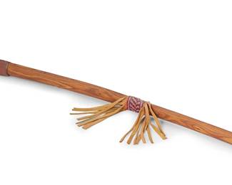 287
A Plains Carved Catlinite Pipe
20th century; Great Plains
Signed to base of stone: [figural motif] / Crow
Pipe head with brushed metallic inlay stripes attached to newer curved wood stem embellished with a beaded and hide fringe embellishment to center
30" L x 4" H x 1" Dia. approximately
Estimate: $200 - $300