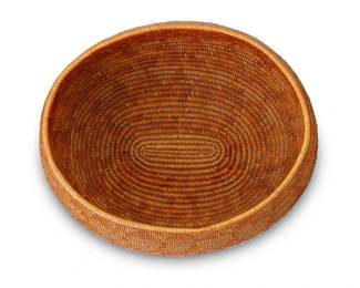 38
A California Mission Basket
Early 20th century; Southern California
A coiled oval bowl with geometric banding
4.5" H x 9" W x 7.75"D approximately
Estimate: $500 - $700