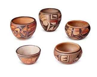322
A Group Of Hopi Pueblo Polychrome Pottery Bowls
Early/mid-20th century; Arizona
One signed: Ethel Youvella Polacca Ariz.; one marked with Hattie Carl raincloud flower cipher; one marked with leafless flower cipher
The yellowware group comprising a likely Hattie Carl (1866-1970, Hopi) bowl with three-color geometric and moth motifs, an Ethel Youvella (1919-2006, Hopi-Tewa) bowl with three-color banded kiva step and fauna motifs, and three more bowls, each with various geometric motifs, 5 pieces
Tallest bowl: 4.875" H x 5.25" Dia.; smallest: 2.75" H x 4.75" Dia.
Estimate: $300 - $500
