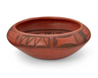 315
Erma Tawyesva (1897-1993, Hopi Pueblo)
A pottery low bowl, late 20th century; Arizona
Signed to underside: Erma Tawyesva / Polacca, Ariz.
The black on red wash bowl with geometric banding to exterior and geometric motif to the interior
3.5" H x 9.25" Dia.
Estimate: $300 - $500