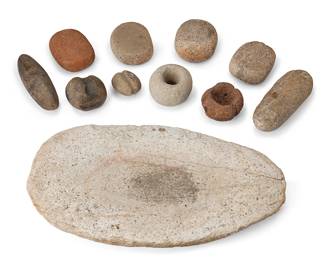 289
A Group Of Stone Implements
Pre-historic or later
Comprising a group of carved stone objects including ax heads, net stones or sinkers, a mortar or paint pot, and a flat mortar and oval grinding stone, 11 pieces
Largest: 1.25" H x 17.25" W x 10" D; smallest: 2.25" H x 2.5" W x 1.5" D
Estimate: $200 - $400