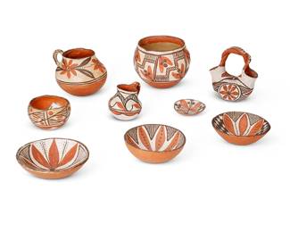 353
A Group Of Puebloan Polychrome Pottery Items
Early/mid-20th century; Southwestern United States
Each appears unmarked
The three-color painted vessels comprising four bowl/dishes, an Isleta Pueblo wedding vase, two Isleta handled pitchers, a small Isleta bowl, and an Acoma Pueblo jar, each with painted floral motifs, 9 pieces
Largest: 4.5" H x 5.5" Dia.; smallest: 0.625" H x 2.875" Dia.
Estimate: $200 - $400