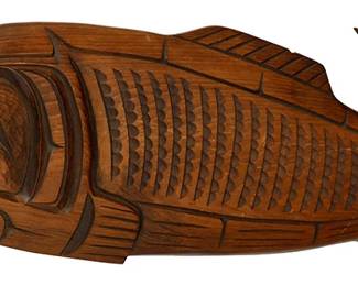 92
Charles Harper (B. 20th Century, Kwakiutl/Kwakwaka'wakw)
A carved wood salmon plaque, late 20th century; Pacific Northwest Coast
Signed and inscribed in pen verso: Kwakiutl / Salmon / Charles Harper
A flat wall plaque with elaborate carved relief details of a stylized salmon
8.5" H x 23" W x 1" D
Estimate: $200 - $400
