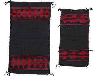 258
Two Navajo Moki-Style Dresses
20th century, Diné
Each formed of two pieces woven in black and red wool with stepped and serrated banding to ends, each constructed with shoulder and side seams, 2 pieces
Larger: 36" H x 19.5" W; smaller: 28" H x 13.75" W
Estimate: $500 - $700