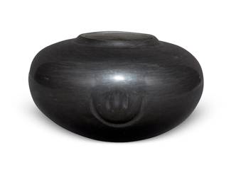 238
Virginia Garcia (B. 1963, Santa Clara/Ohkay Owingeh)
A blackware pottery jar, 1989
Incised to underside: Virginia Garcia / San Juan/Santa Clara / 9-89
A wide, low-shouldered bowl with three impressed bear paw motifs to waist
4.25" H x 6.75" Dia.
Estimate: $200 - $400