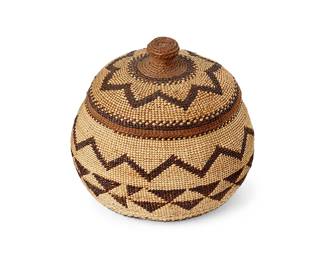 196
A Small Lidded Hupa/Yurok/Karuk Basket
Early/mid-20th century; Northern California
A diminutive twined basketry bowl with banded imbricated motifs and star/flower motif to lid, 2 pieces
3.75" H x 4" Dia. including lid
Estimate: $500 - $700