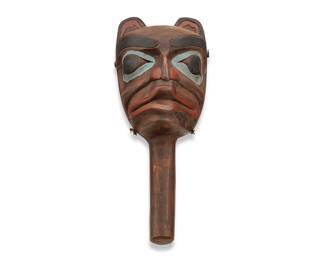 88
A Northwest Coast Polychrome Rattle
Early 20th century; Pacific Northwest Coast
A polychrome stained carved wood rattle with painted bear visage and corded lashing to sides
11.5" H x 4.75" W x 4.75" D
Estimate: $500 - $700