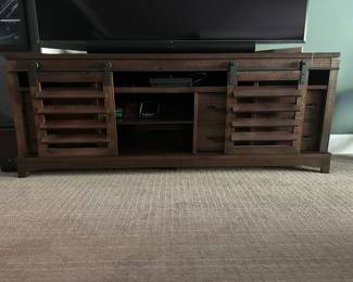 H79 - $250 - Basement Media Console with sliding doors. Measures 15.75" deep x 87.75" long x 33.5" tall. Rooms To Go Furniture. 