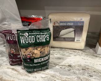 H52 - $3 all wood chips - $12 New in Package Rug Pad