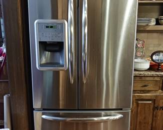 GE Double door refrigerator with freezer drawer on the bottom