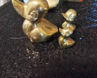 three brass ducks