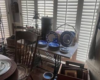 Marble top table with sewing machine base