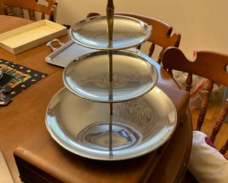 Tiered metal display in kitchen 