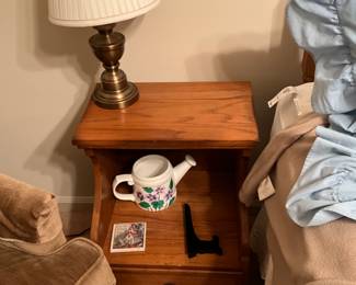End table, lamp, & decor in bedroom