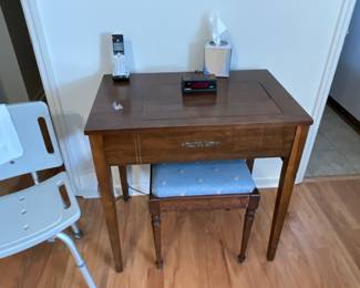 Vintage Singer sewing machine cabinet with stool
