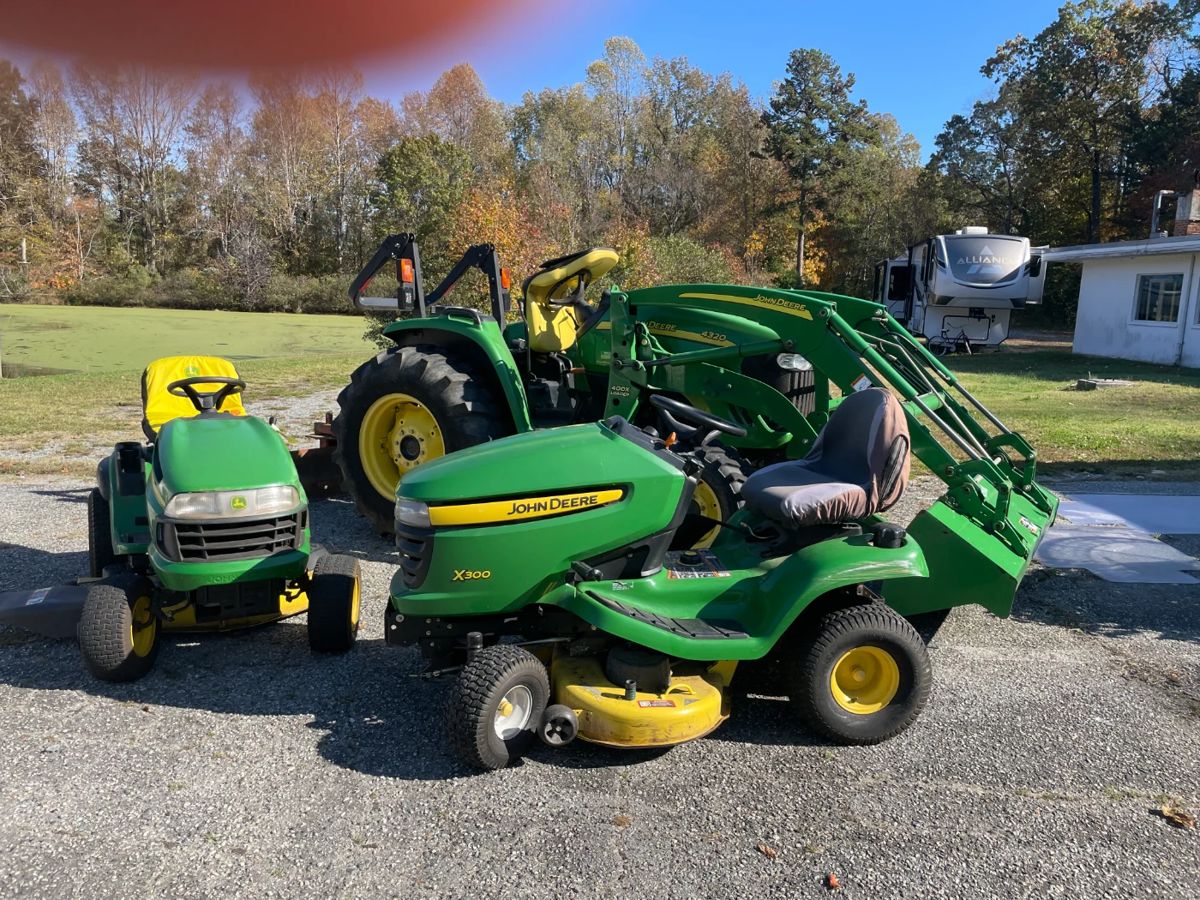 John Deere 4320 Tractor, John Deere X-3000 riding mower and John Deere LA130 riding mower