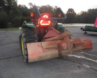 Tractor comes with scape blade