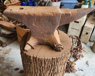 Blacksmith Anvil Bolted on Log