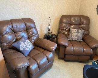 Two faux leather recliners