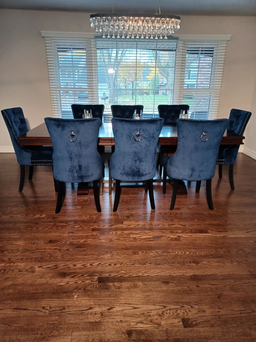 Blue Velvet Chairs with Formal Wooden Dining Room Table that has two Leaves.