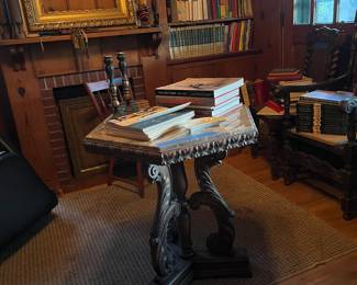 Lots of books
Gold frames
Marble top antique table