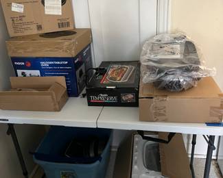 Kitchen gadgets still in the box- these would make great Christmas gifts. 