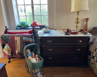 Marble top dresser
Quilts
Antique dolls
Wicker doll carriage