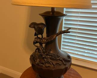 Heavy, tall, bronze lamp with crow or black bird on a branch. Very unique.