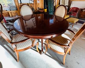 Round dining table and four chairs