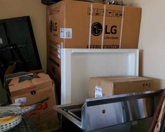 new in box stainless steel refrigerator and stainless steel sink